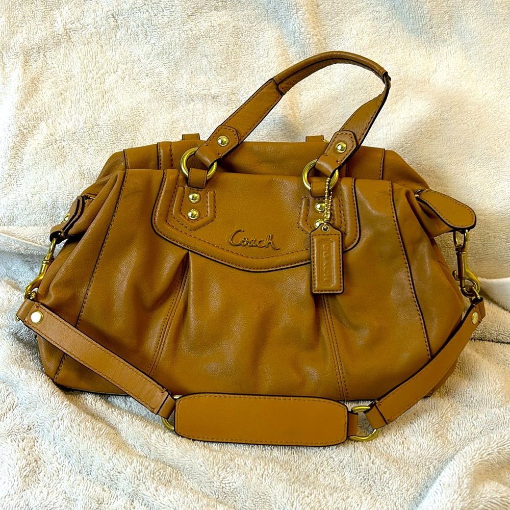 Tan leather Coach purse with handles and shoulder strap